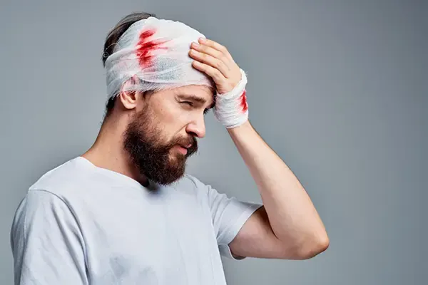 Illustrative photograph of a person with a bandaged head